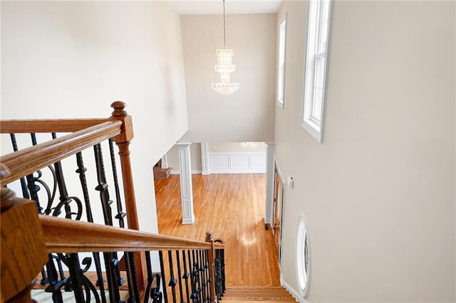 223 Oak Grove Dr, Dallas, GA 30157 - staircase featuring wood finished floors, a chandelier, and a towering ceiling