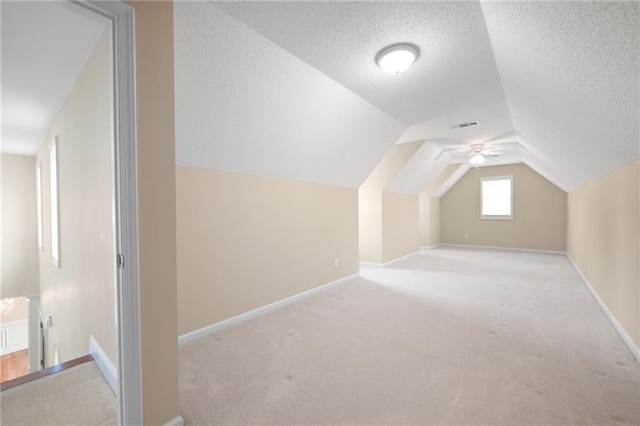 223 Oak Grove Dr, Dallas, GA 30157 - additional living space with a textured ceiling, carpet flooring, vaulted ceiling, and baseboards