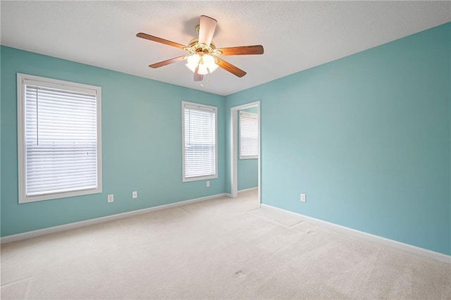 223 Oak Grove Dr, Dallas, GA 30157 - unfurnished room featuring carpet flooring, ceiling fan, baseboards, and a textured ceiling