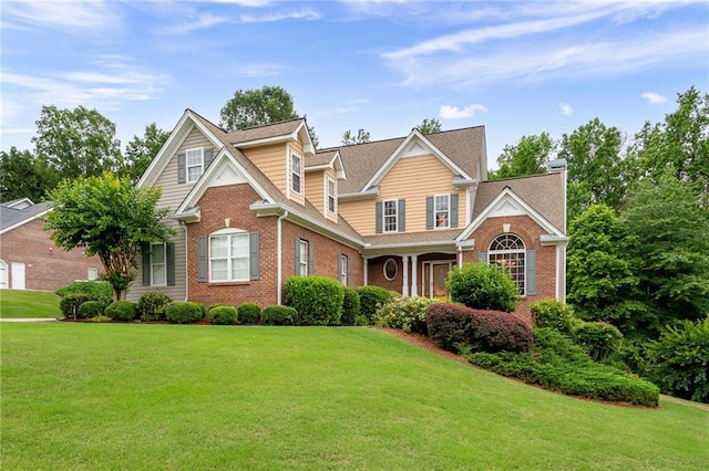 223 Oak Grove Dr, Dallas, GA 30157 - traditional home with brick siding, a front lawn, and a chimney