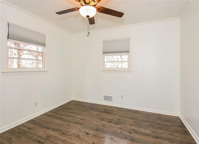 empty room featuring crown molding, ceiling fan, and dark hardwood / wood-style floors