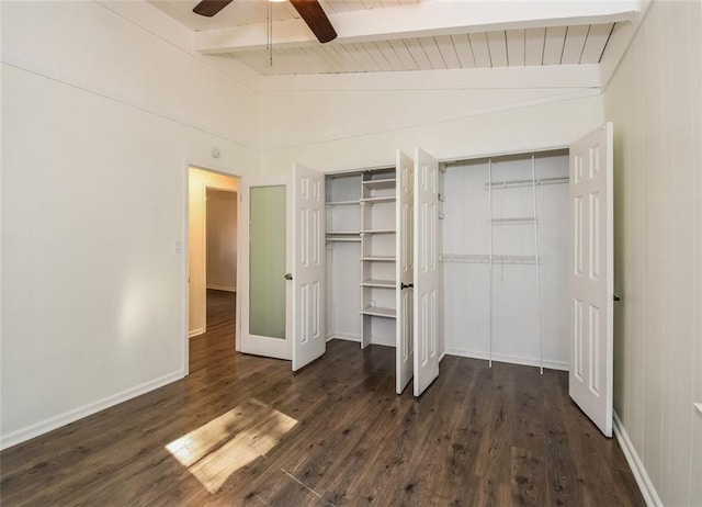 unfurnished bedroom with lofted ceiling with beams, dark hardwood / wood-style floors, ceiling fan, and wood ceiling