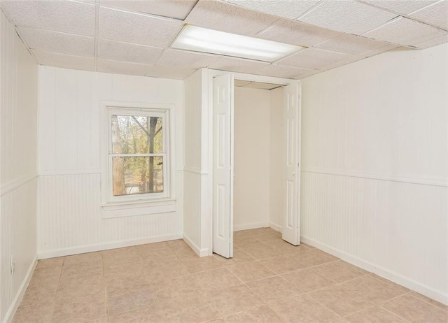 interior space featuring a paneled ceiling