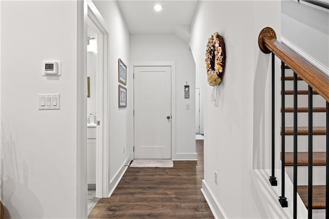 hall with recessed lighting, baseboards, and dark wood-style floors