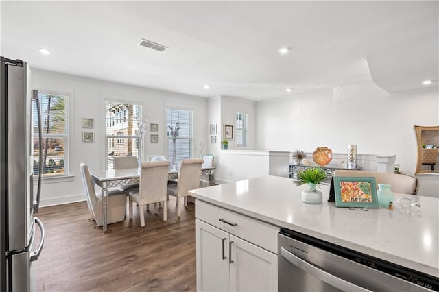 kitchen with visible vents, dark wood-style floors, white cabinetry, recessed lighting, and appliances with stainless steel finishes