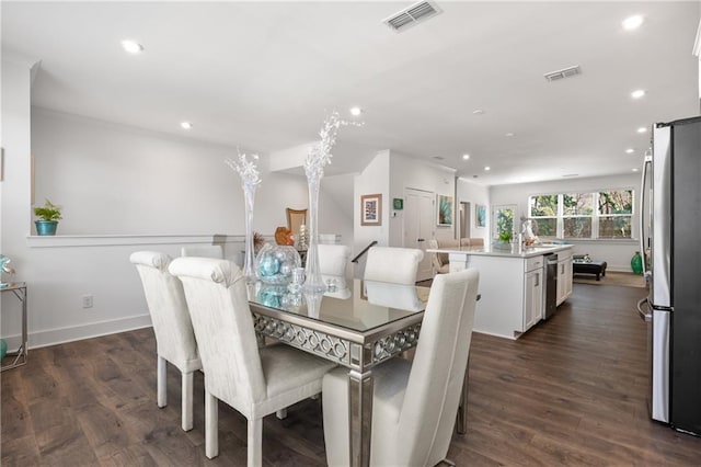 dining room featuring recessed lighting, visible vents, and dark wood-style flooring