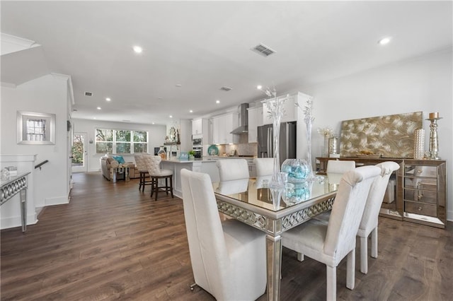 dining space featuring visible vents, recessed lighting, and dark wood-style flooring