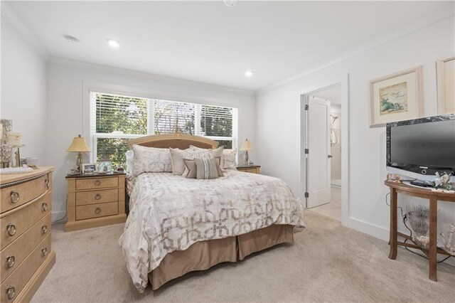 bedroom with recessed lighting, baseboards, light colored carpet, and crown molding