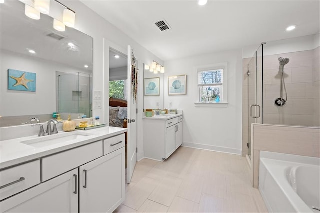 bathroom featuring a sink, visible vents, and a shower stall