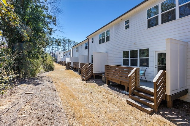 back of property with a wooden deck