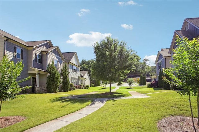 view of home's community with a yard and a residential view