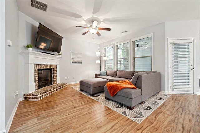 5925 Watersdown Way, Flowery Branch, GA 30542 - living room with ceiling fan, wood finished floors, and baseboards