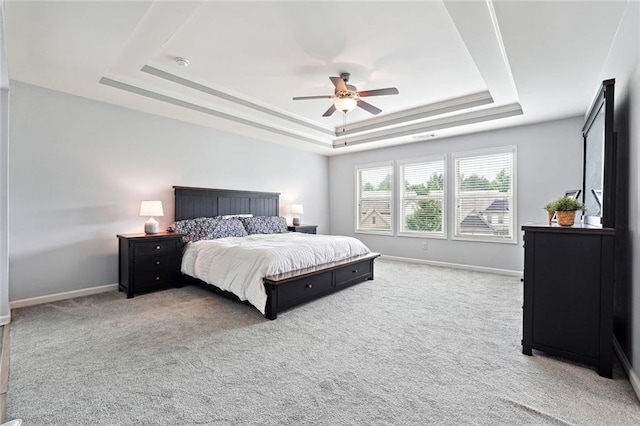 5925 Watersdown Way, Flowery Branch, GA 30542 - carpeted bedroom with a raised ceiling, baseboards, and a ceiling fan
