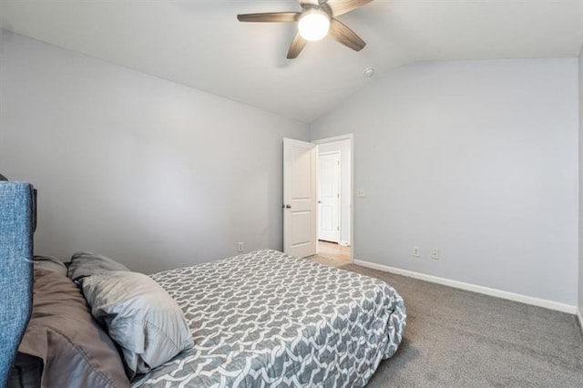 carpeted bedroom with lofted ceiling, baseboards, and ceiling fan