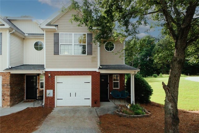 view of front of home featuring a garage and a front yard