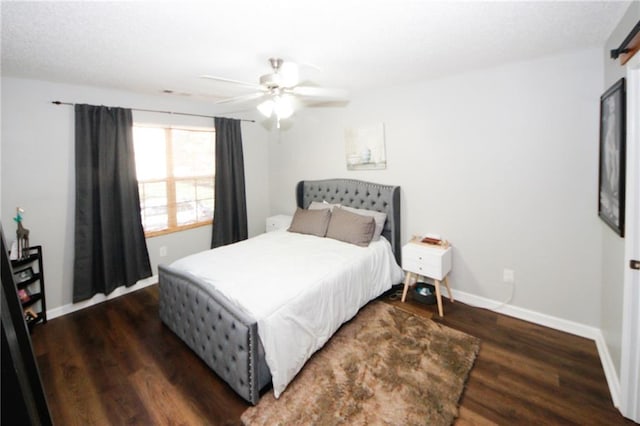 bedroom featuring dark hardwood / wood-style floors and ceiling fan