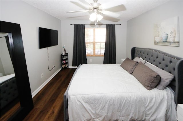 bedroom featuring ceiling fan and dark hardwood / wood-style flooring