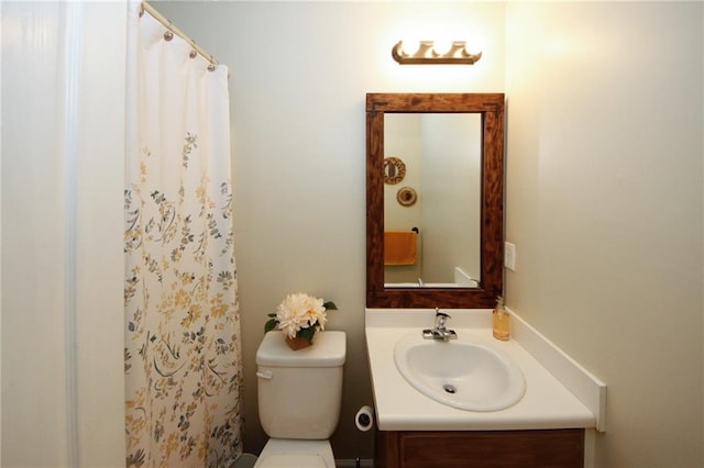 bathroom featuring vanity, a shower with curtain, and toilet