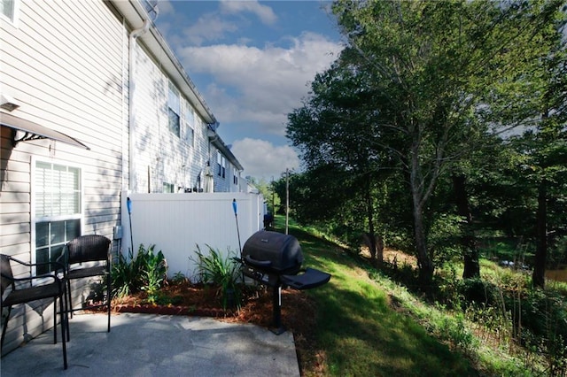 view of patio featuring a grill