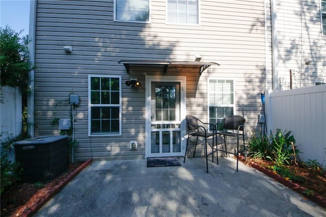 back of house with a patio and central AC