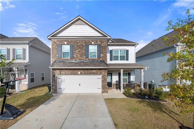 craftsman house with a garage, a front yard, and covered porch