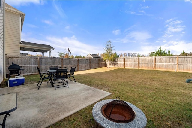 view of yard featuring a patio area and a fire pit