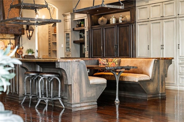 bar with dark wood-type flooring