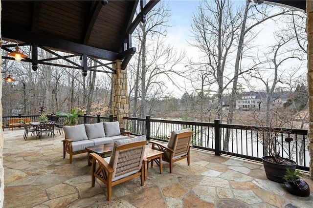 view of patio / terrace with outdoor dining space, outdoor lounge area, and a gazebo