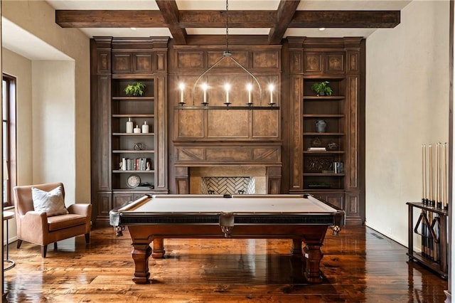 rec room with built in shelves, beam ceiling, coffered ceiling, and wood finished floors