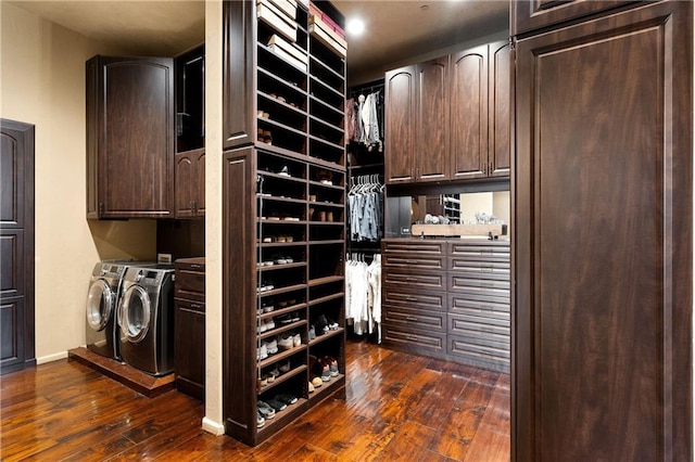 interior space with cabinet space, baseboards, dark wood-style floors, and separate washer and dryer