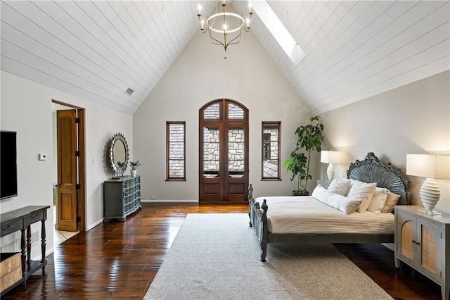 bedroom with baseboards, dark wood-type flooring, french doors, high vaulted ceiling, and a notable chandelier