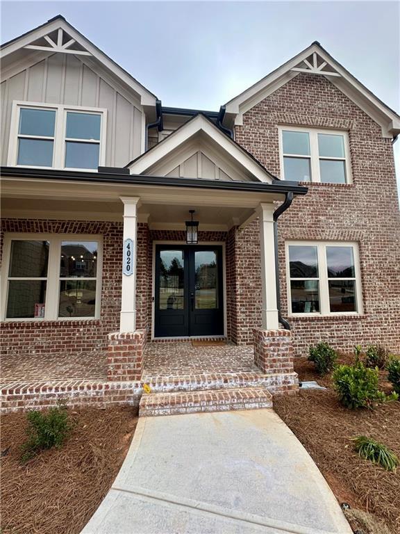 entrance to property featuring covered porch and french doors