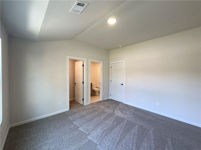 unfurnished room with carpet and vaulted ceiling