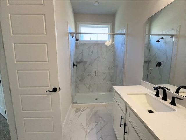 bathroom with vanity and a shower with shower door