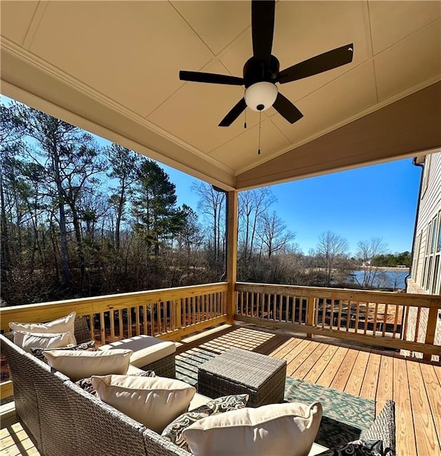 deck featuring ceiling fan and an outdoor living space