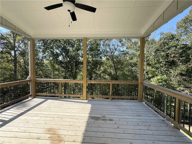 wooden terrace featuring ceiling fan