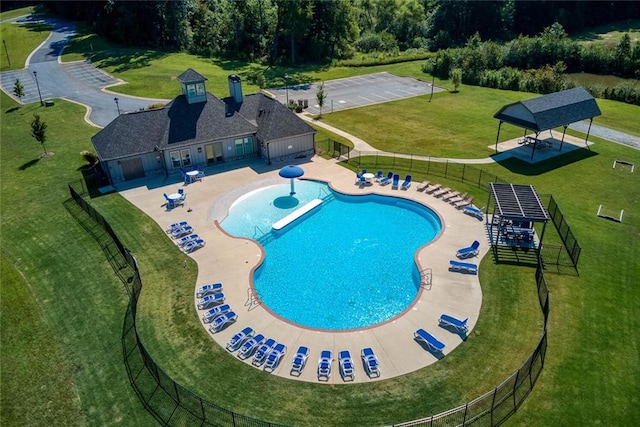 view of pool featuring a yard