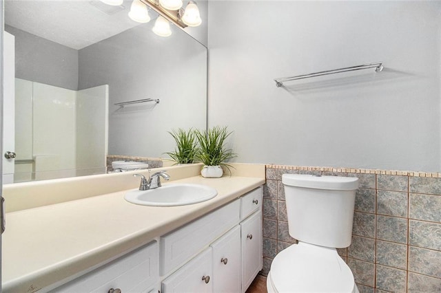 2722 Spring Side Ct, Douglasville, GA 30135 - bathroom featuring toilet, vanity, a shower, and tile walls