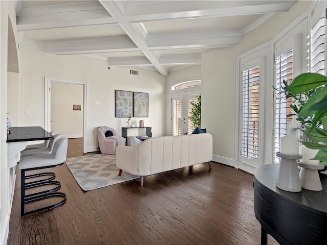 living room with coffered ceiling, beam ceiling, dark wood-type flooring, and french doors