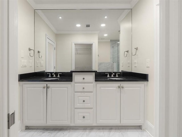 bathroom with walk in shower, ornamental molding, and vanity