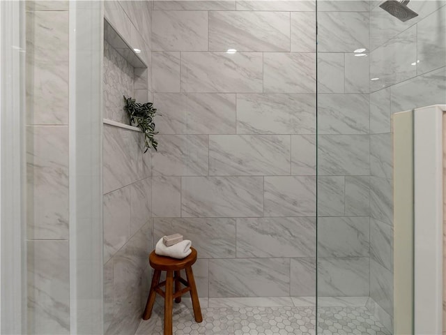 bathroom with tiled shower