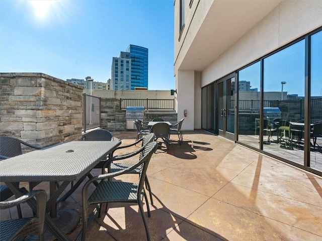 exterior space with exterior kitchen and a patio