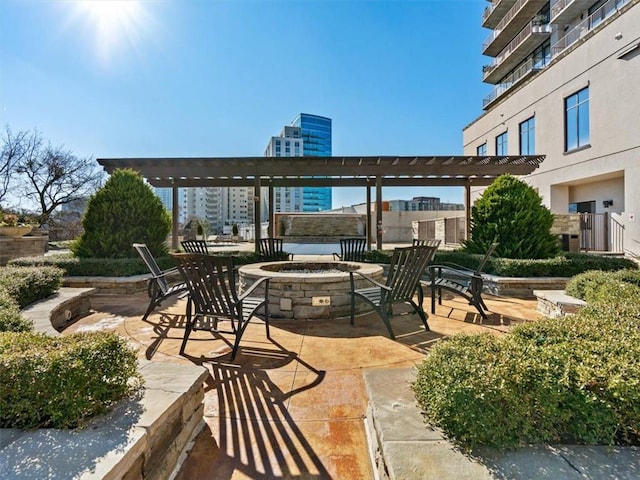 view of patio / terrace featuring an outdoor fire pit