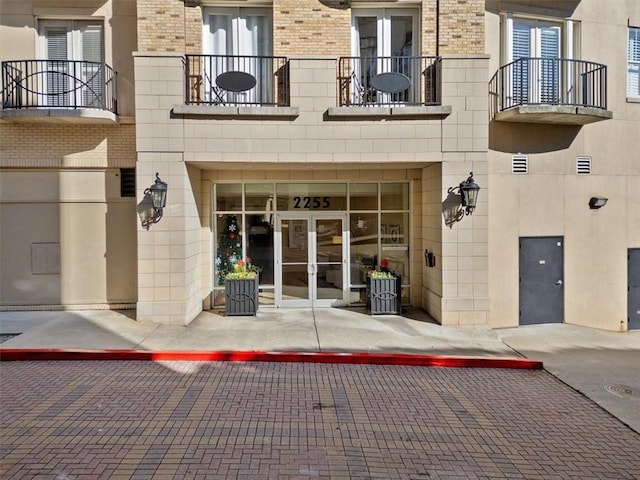 property entrance featuring french doors