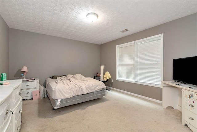 3265 Watson Gate Rd, Loganville, GA 30052 - bedroom featuring light colored carpet, a textured ceiling, and baseboards