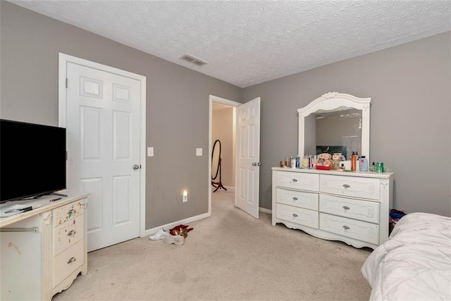 3265 Watson Gate Rd, Loganville, GA 30052 - bedroom with light colored carpet, baseboards, and a textured ceiling