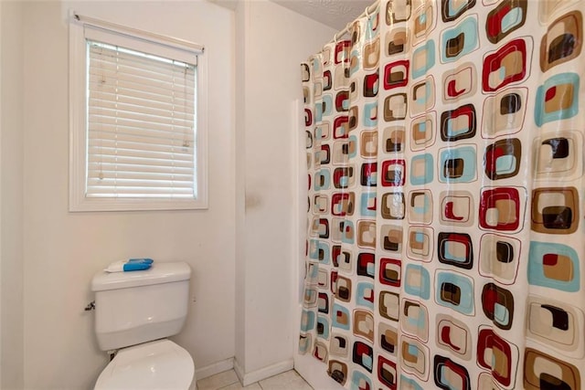 3265 Watson Gate Rd, Loganville, GA 30052 - full bathroom with a shower with curtain, toilet, tile patterned flooring, and baseboards