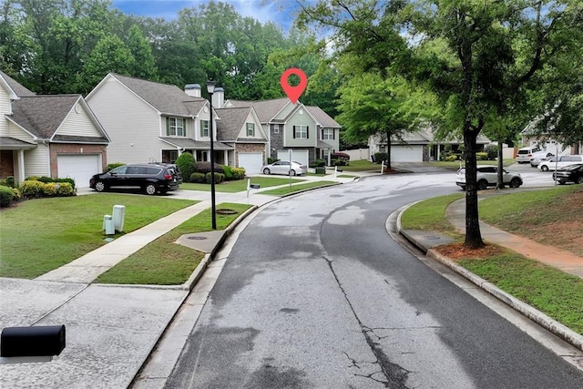 3265 Watson Gate Rd, Loganville, GA 30052 - view of asphalt street featuring curbs, a residential view, and sidewalks