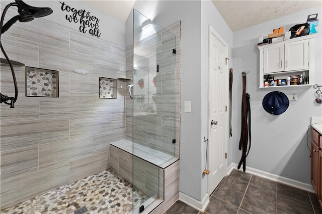 69 Maple Leaf Ct, Hoschton, GA 30548 - bathroom with a stall shower, vanity, and tile patterned floors