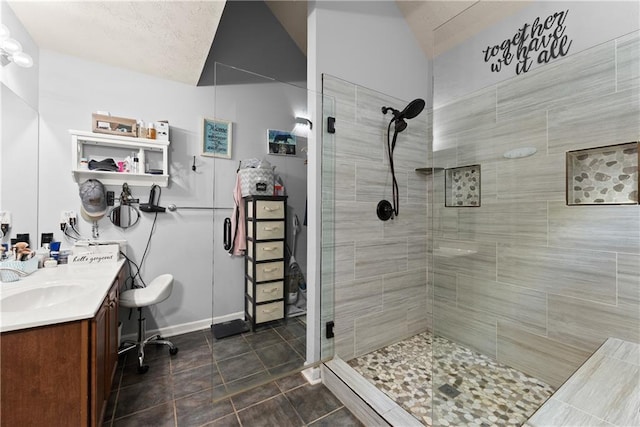 69 Maple Leaf Ct, Hoschton, GA 30548 - full bath with tiled shower, vanity, and lofted ceiling